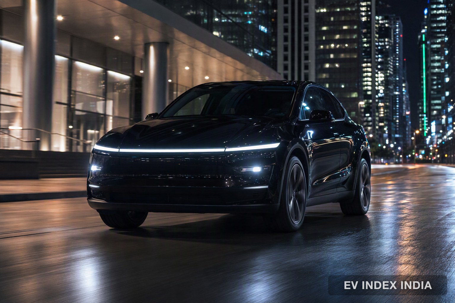 A black coupe-style electric SUV in a city at night